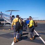 Miners boarding a plane for FIFO work